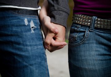 Young couple in love, holding hands