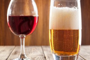 Red wine glass and glass of light beer