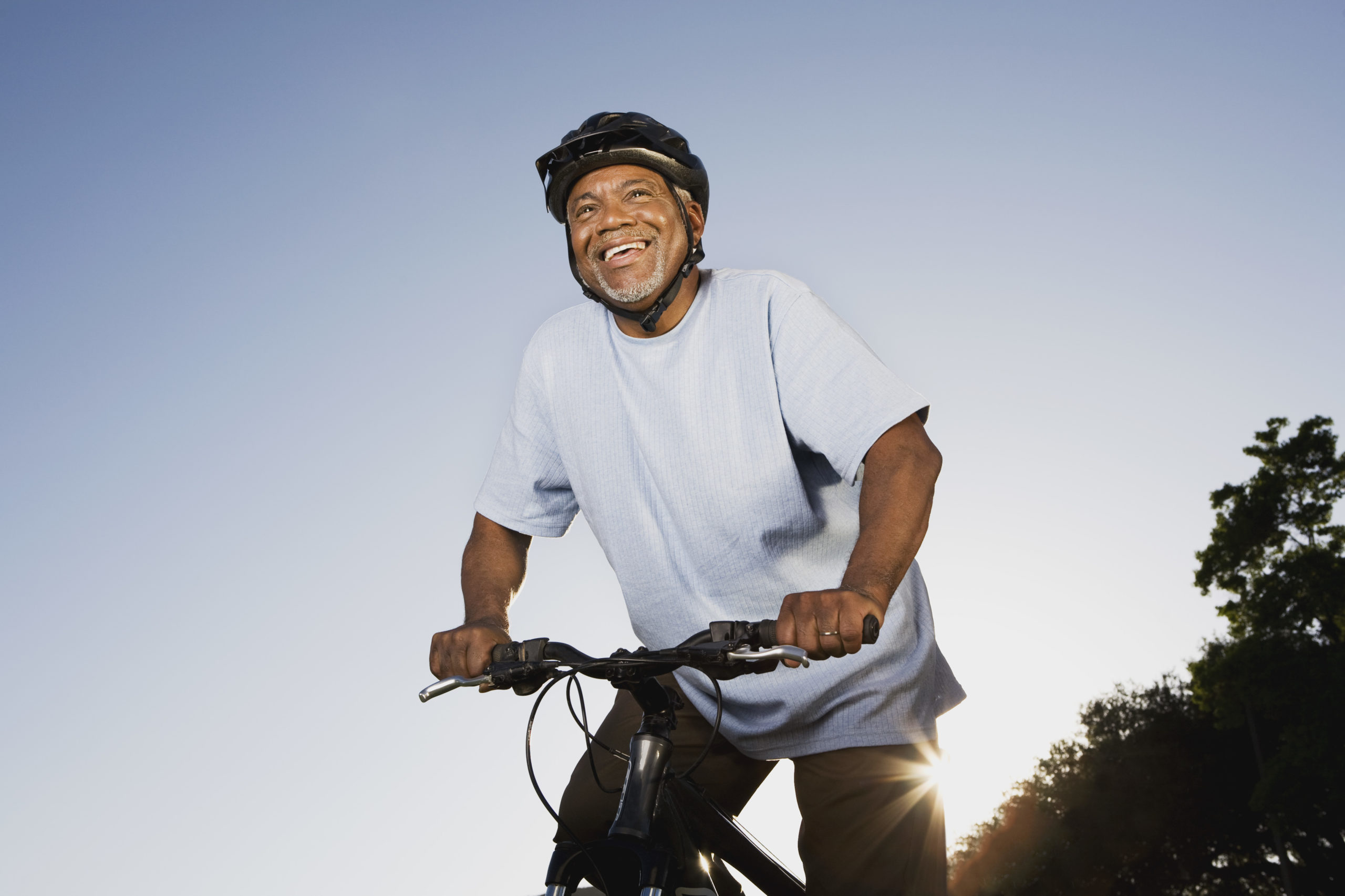 Smiling senior man with mountain bike