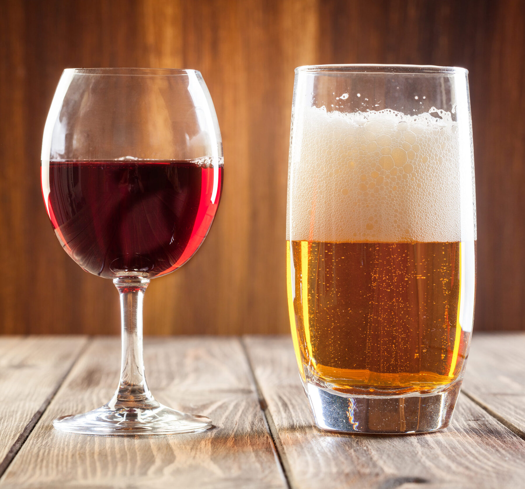 Red wine glass and glass of light beer
